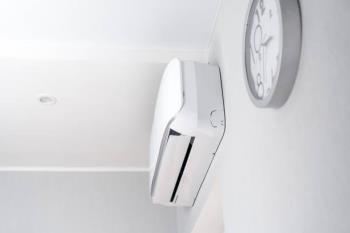 Modern home interior with the newly installed ductless mini-split system on the wall